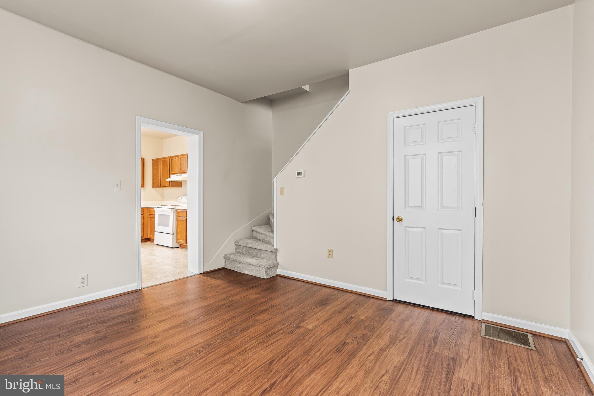 44 Madison Avenue Hagerstown, MD 21740 - Photo 12 of 24 an empty room with wooden floor and windows