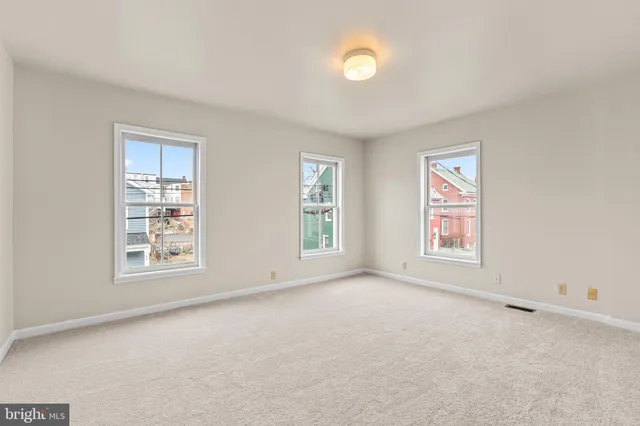 an empty room with windows