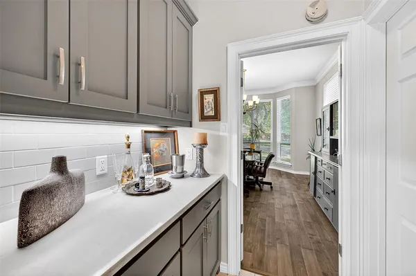a kitchen with a refrigerator and cabinets