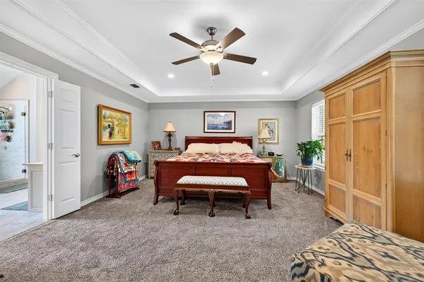 a bed room with a bed and a chandelier