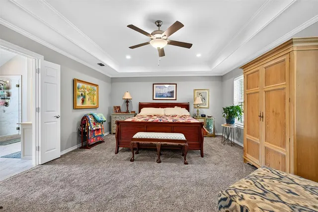 a bed room with a bed and a chandelier