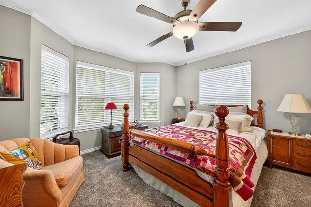 a bedroom with bed and a couch