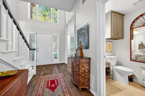 a living room with furniture and a rug