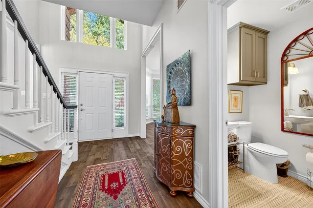 a living room with furniture and a rug