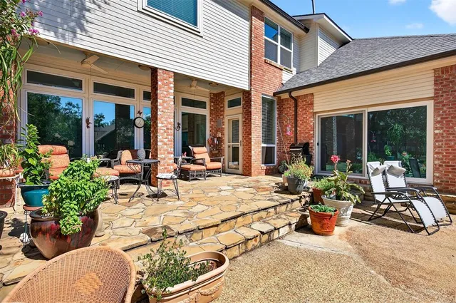 a view of a building with sitting area and furniture