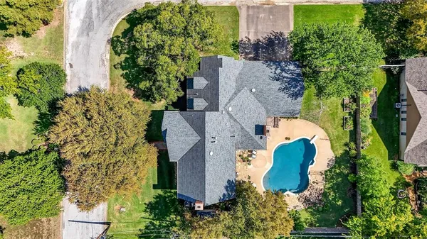 an aerial view of a house with a garden