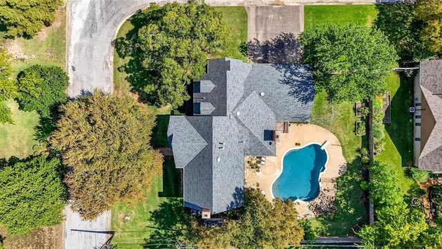 an aerial view of a house with a garden