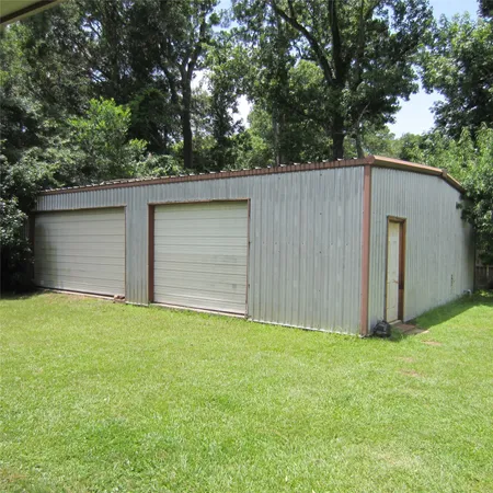 a backyard of a house with garage