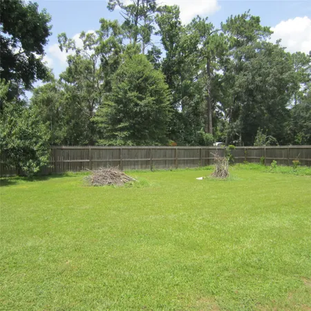 a view of a swimming pool with a yard