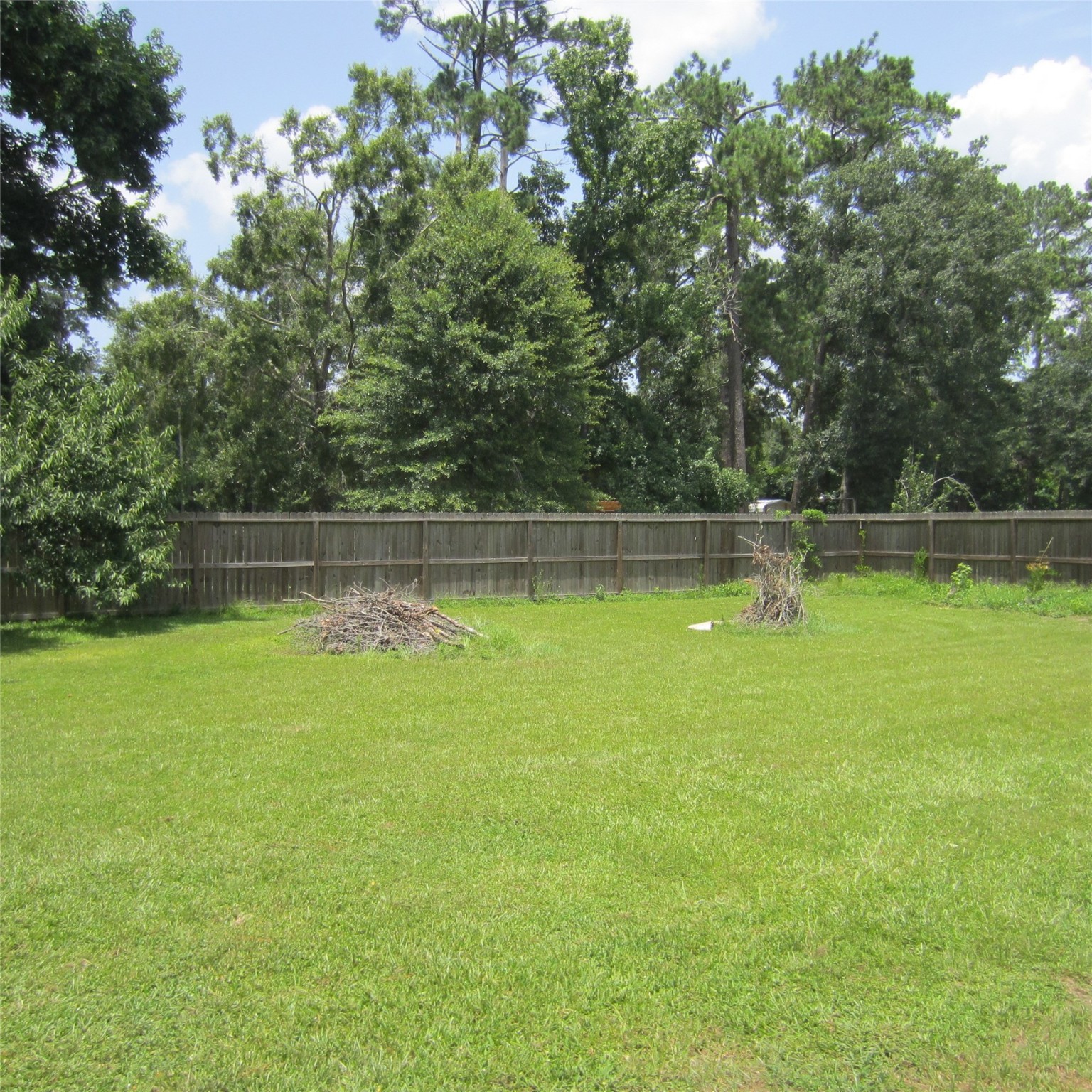 14758 Lucas Drive Splendora, TX 77372 - Photo 14 of 36 a view of a swimming pool with a yard