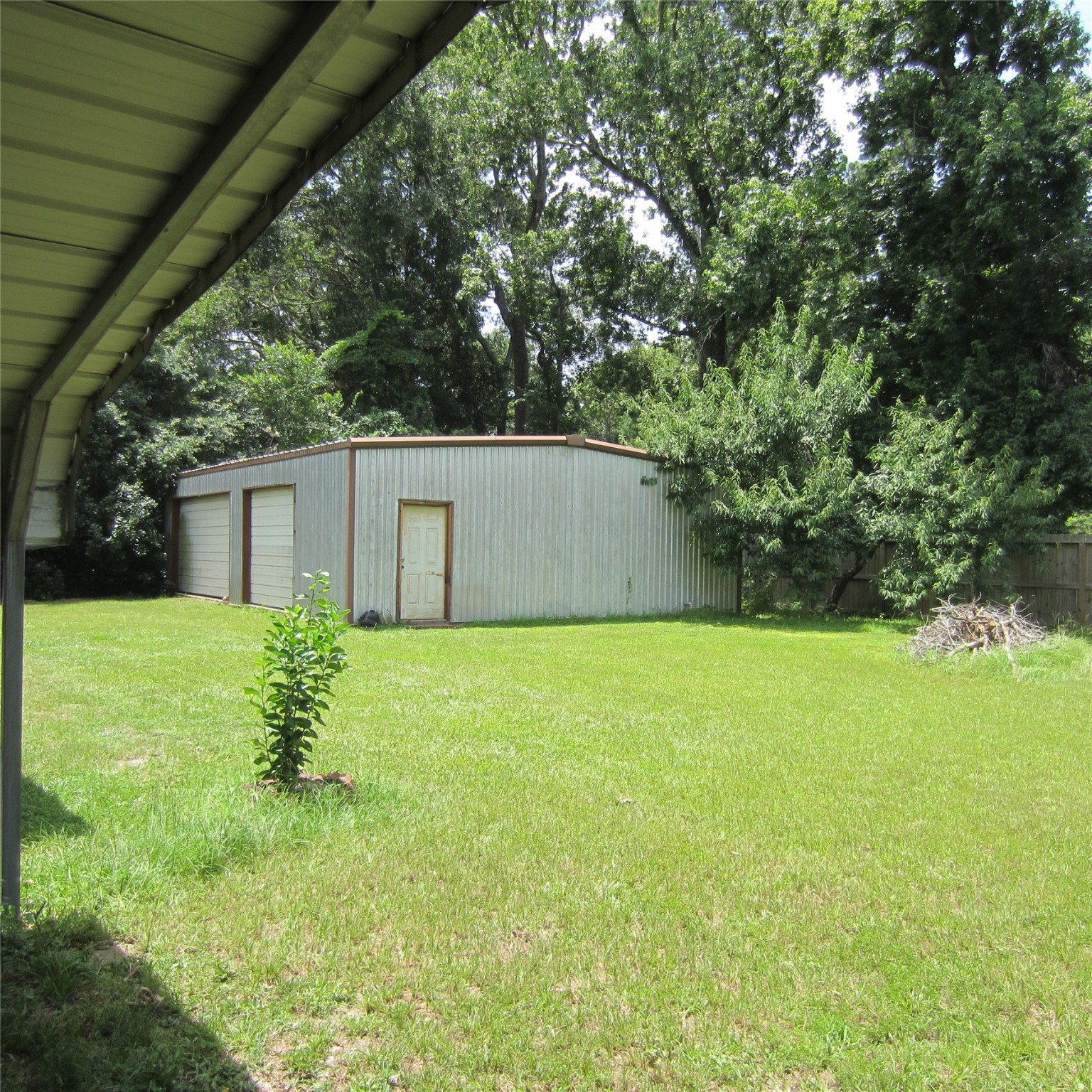 14758 Lucas Drive Splendora, TX 77372 - Photo 30 of 36 a view of a backyard