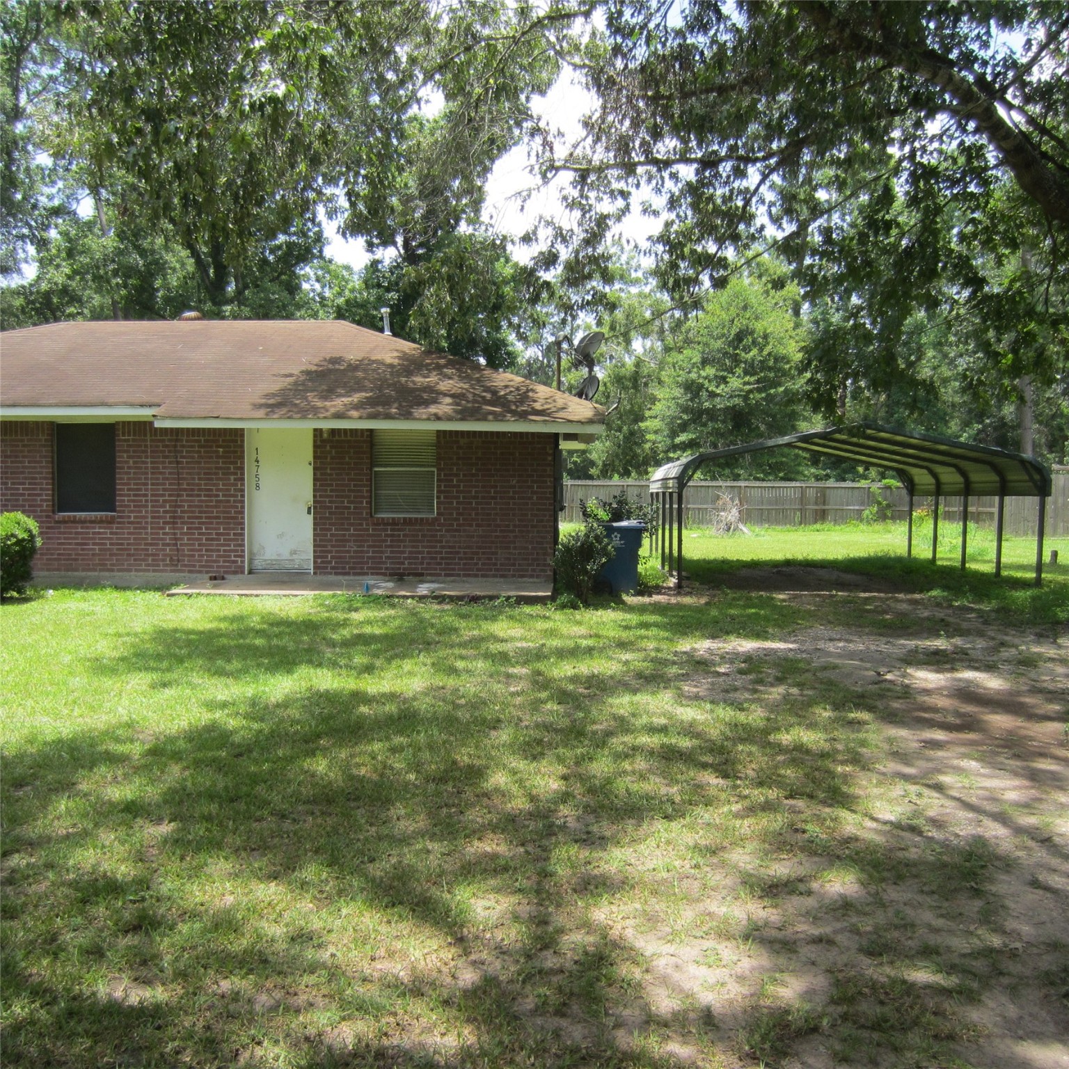 14758 Lucas Drive Splendora, TX 77372 - Photo 31 of 36 a front view of a house with garden