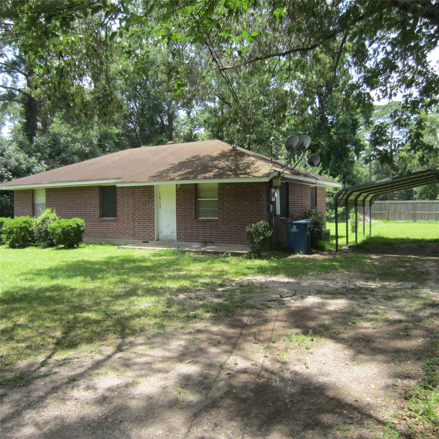 14758 Lucas Drive Splendora, TX 77372 - Photo 32 of 36 a front view of house with a garden