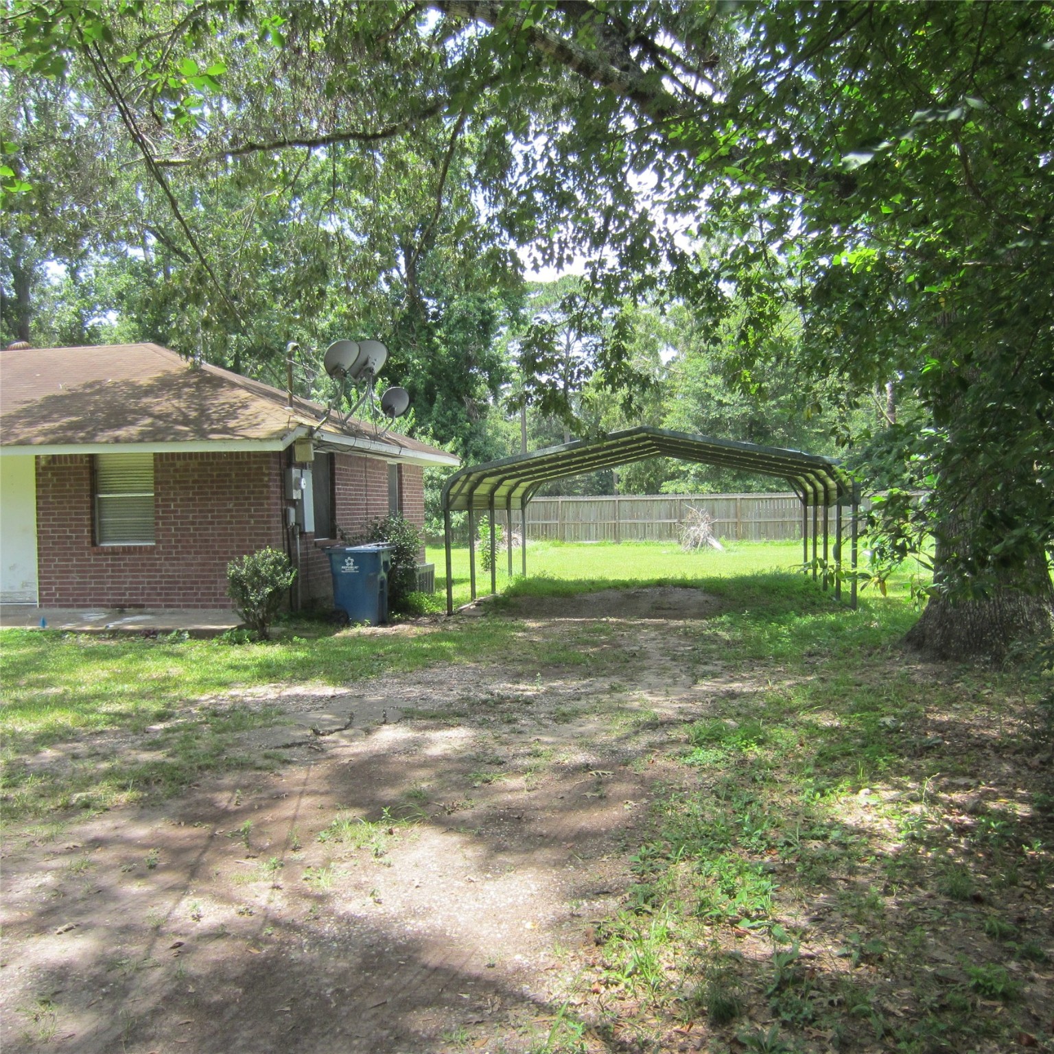 14758 Lucas Drive Splendora, TX 77372 - Photo 33 of 36 a front view of a house with a yard and a garage