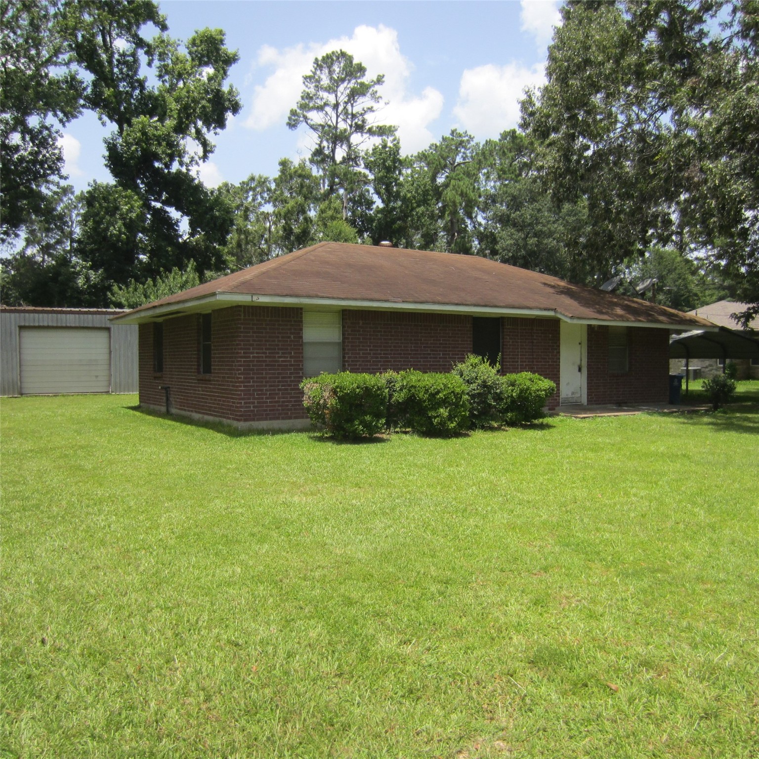 14758 Lucas Drive Splendora, TX 77372 - Photo 34 of 36 a front view of a house with garden