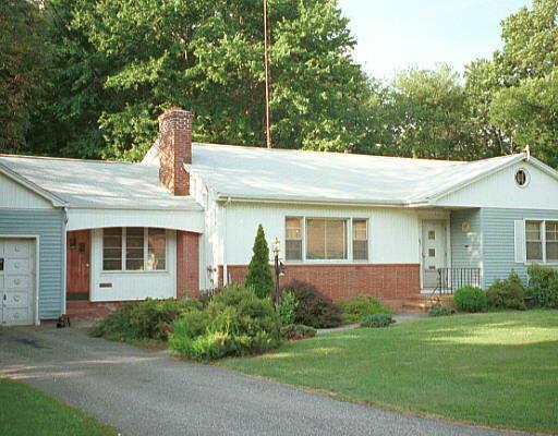 23 Walker Road Trumbull, CT 06611 - Photo 1 of 1 a front view of a house with garden