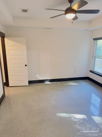 a white bath tub sitting next to a white toilet