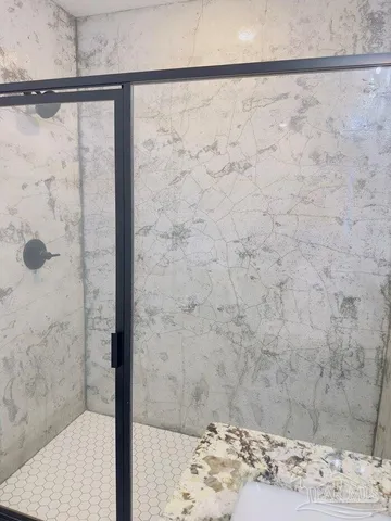 a view of backyard with wooden fence