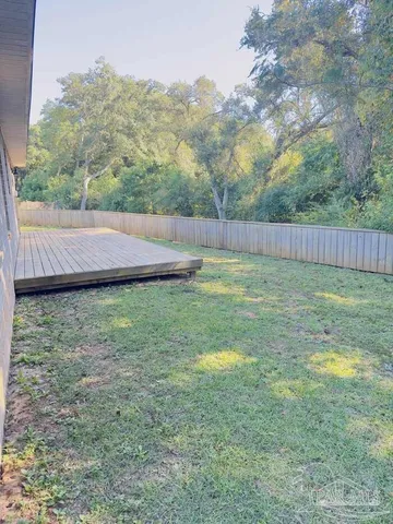 a view of a room with shelf and racks on the wall