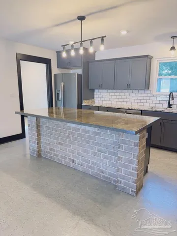 a room with pool table and mirrors