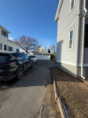 a view of a car parked in front of a house