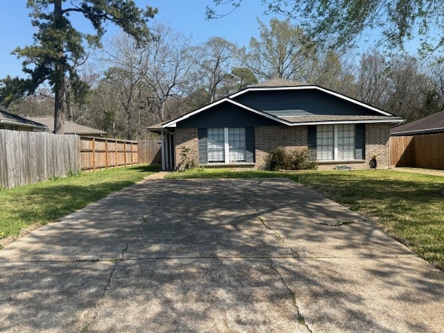22320 Tree House Lane Spring, TX 77373 - Photo 1 of 10 a house with a yard