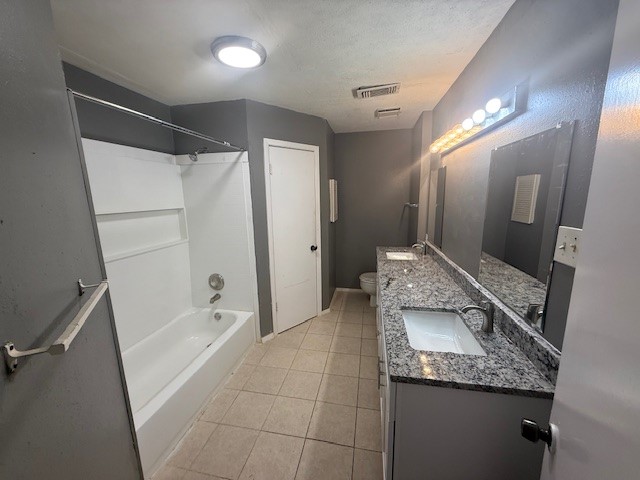 22320 Tree House Lane Spring, TX 77373 - Photo 6 of 10 a bathroom with a granite countertop sink a toilet and shower