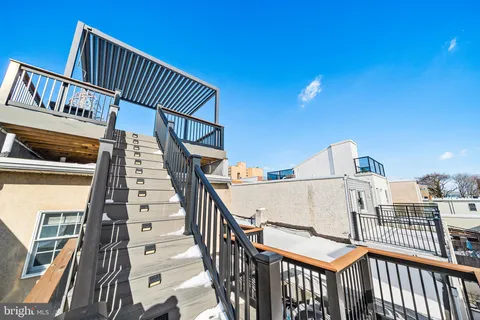 a view of a balcony with wooden floor