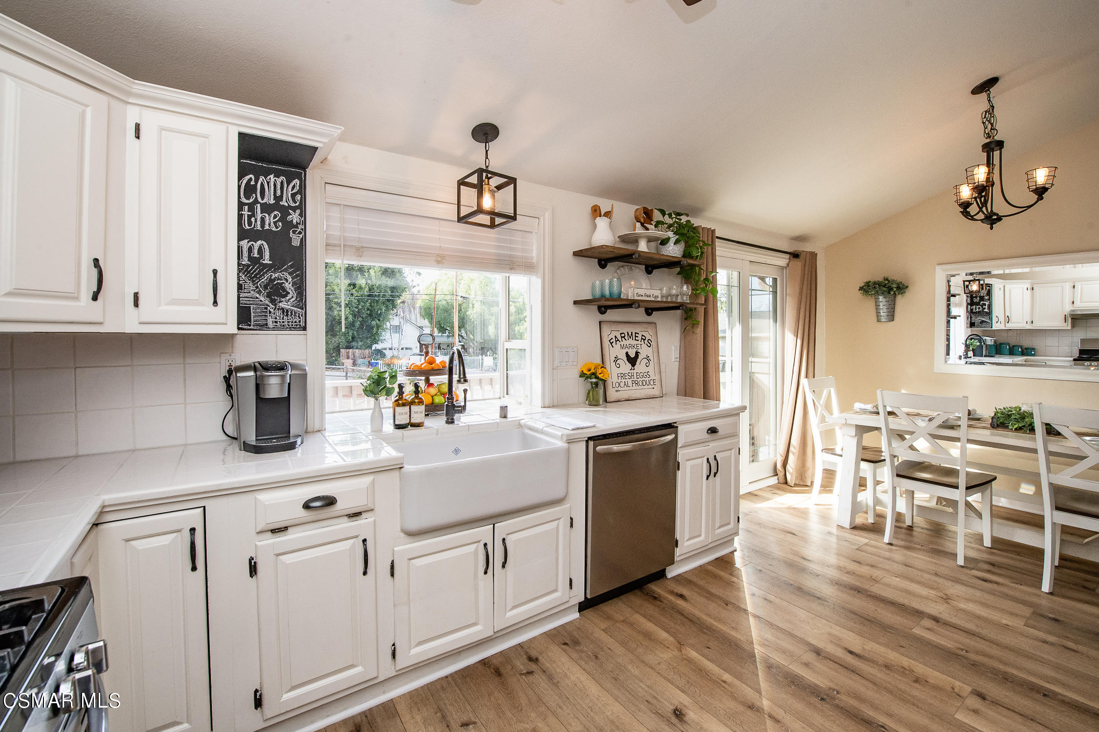 167 Brook Road Newbury Park, CA 91320 - Photo 11 of 30 a large white kitchen with lots of counter top space and furniture