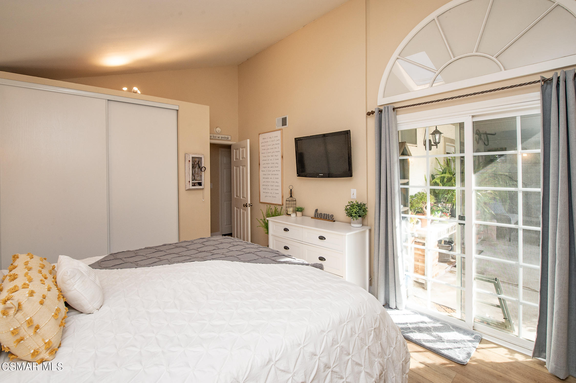 167 Brook Road Newbury Park, CA 91320 - Photo 15 of 30 a bedroom with a bed and a flat tv screen on the dresser