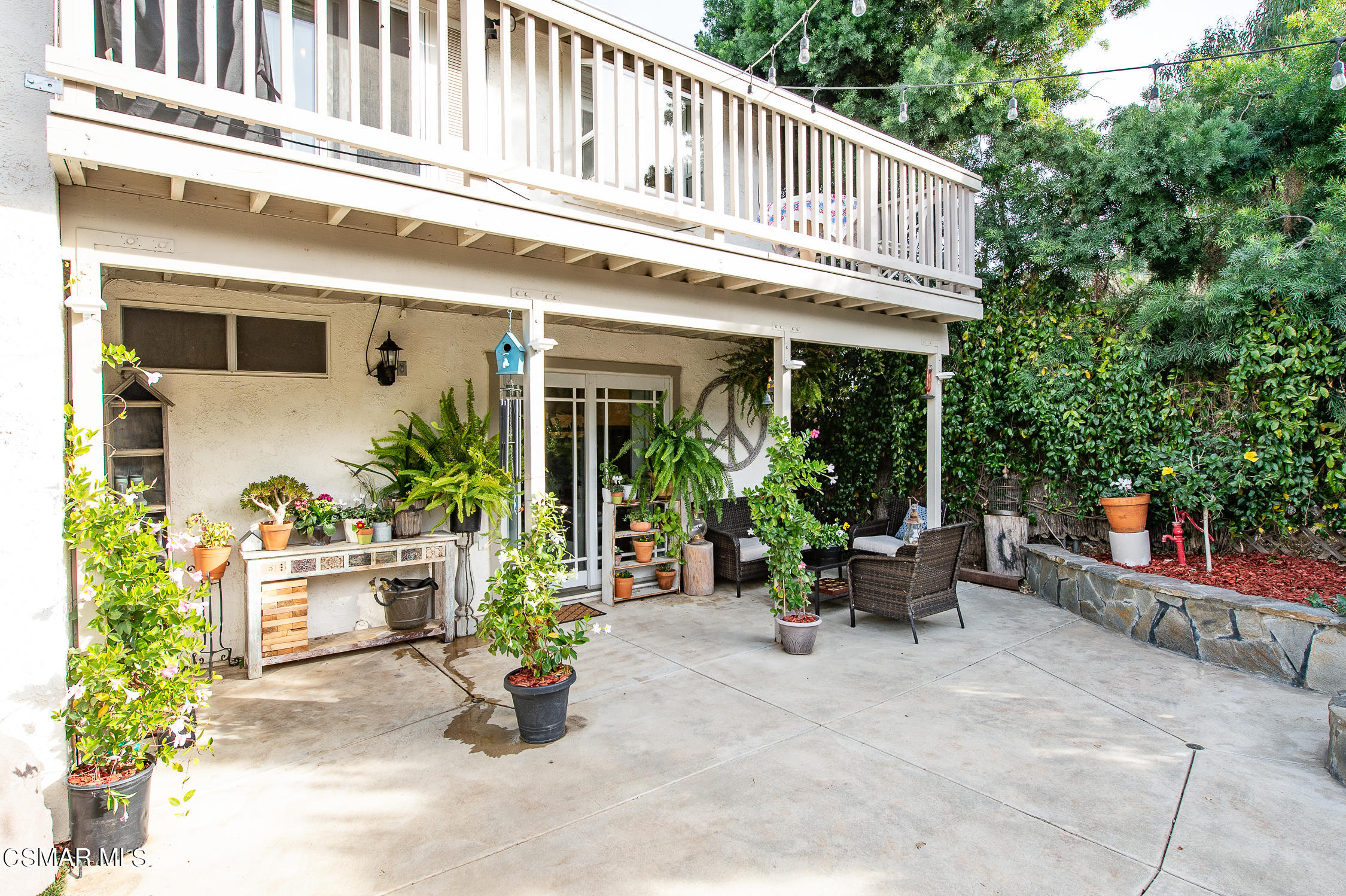 167 Brook Road Newbury Park, CA 91320 - Photo 24 of 30 a front view of a house with outdoor seating and plants