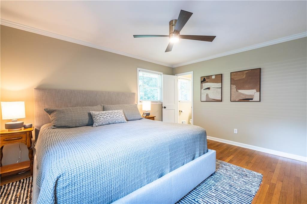 1890 Silvastone Drive Decatur, GA 30033 - Photo 21 of 48 a bedroom with a large bed and a chandelier