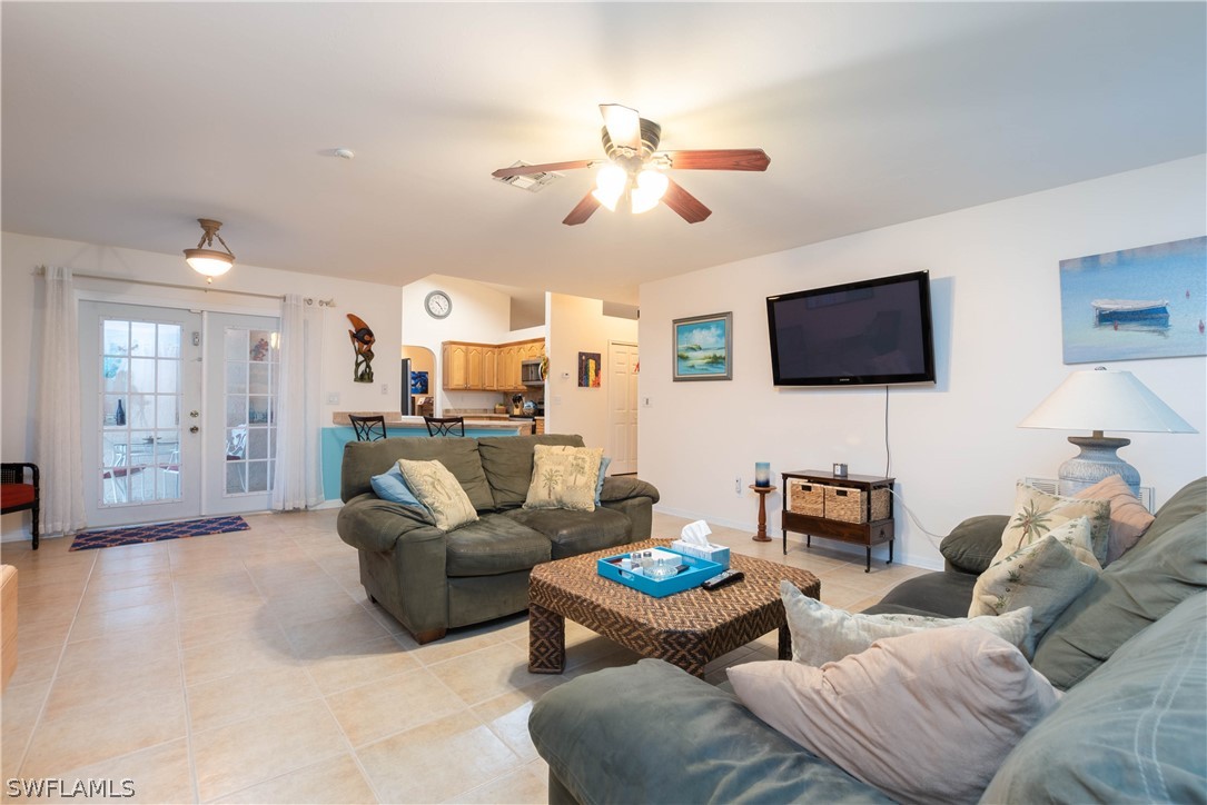 9115 Irving Road Fort Myers, FL 33967 - Photo 21 of 35 a living room with furniture and a flat screen tv