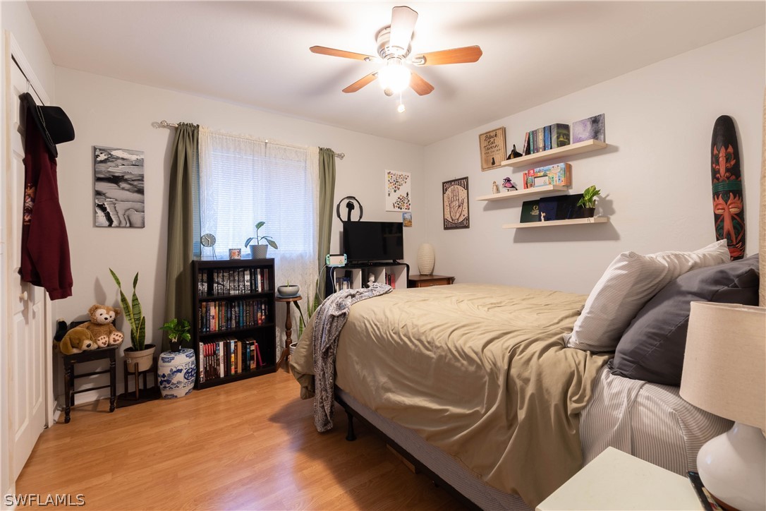 9115 Irving Road Fort Myers, FL 33967 - Photo 24 of 35 a bedroom with a bed and furniture