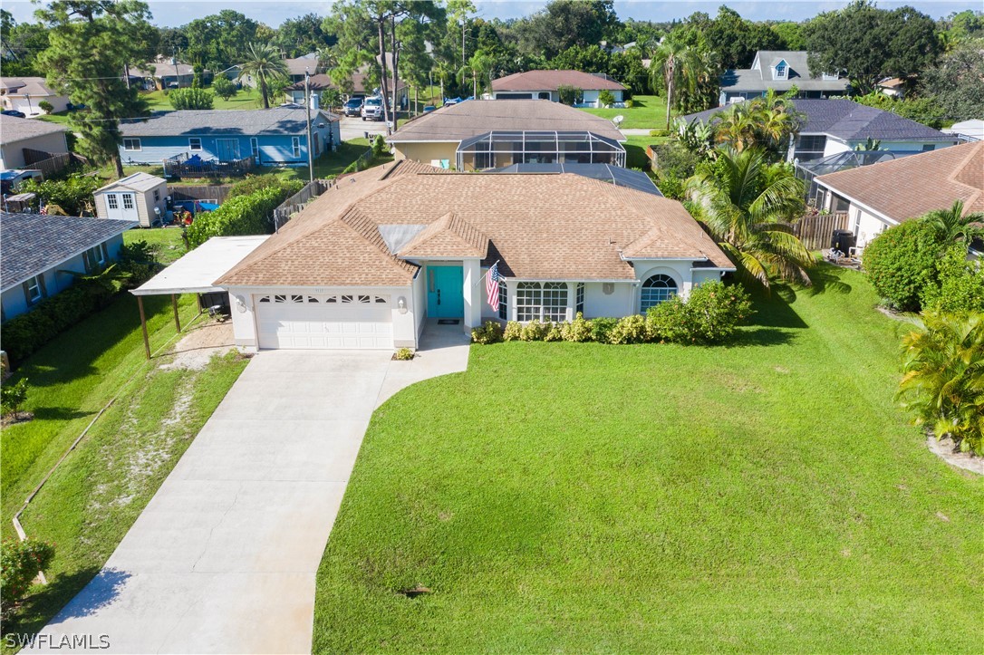 9115 Irving Road Fort Myers, FL 33967 - Photo 3 of 35 a aerial view of a house with garden