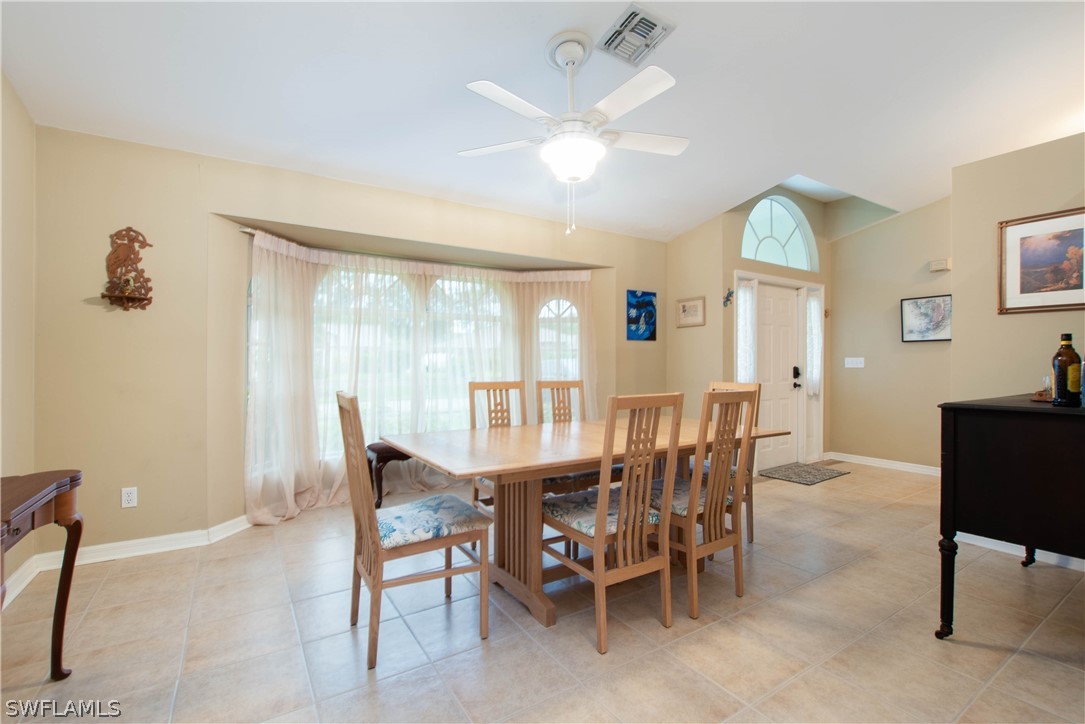 9115 Irving Road Fort Myers, FL 33967 - Photo 5 of 35 a view of a livingroom with furniture window and wooden floor