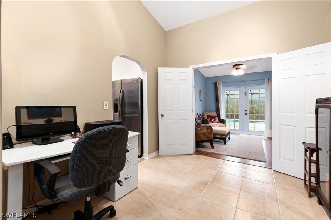 9115 Irving Road Fort Myers, FL 33967 - Photo 8 of 35 a livingroom with workspace and a couch