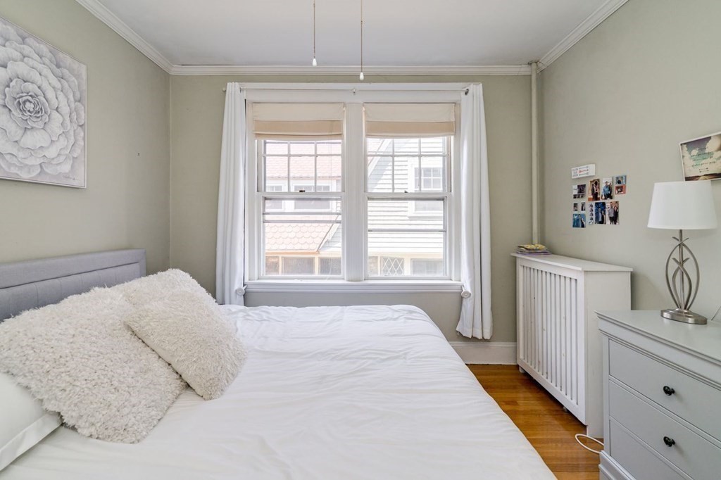 15 Colliston Road, Unit 9 Boston, MA 02135 - Photo 4 of 16 a bedroom with a bed and a window