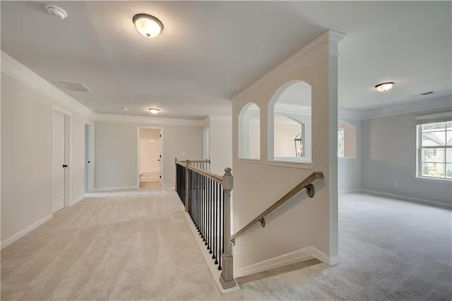 a view of entryway with wooden floor and stairs