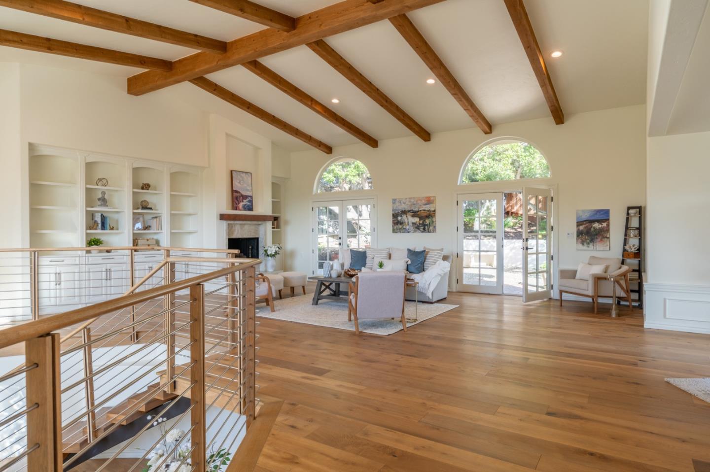 26345 Ladera Drive Carmel, CA 93923 - Photo 11 of 41 a living room with fireplace furniture and a large window