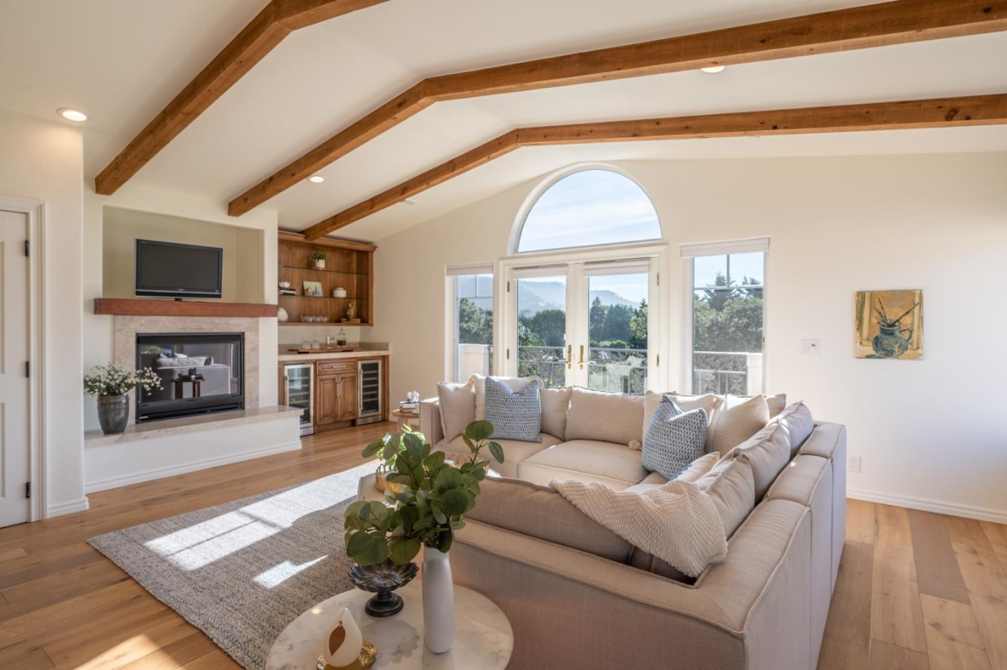 26345 Ladera Drive Carmel, CA 93923 - Photo 17 of 41 a living room with furniture a large window and a fireplace