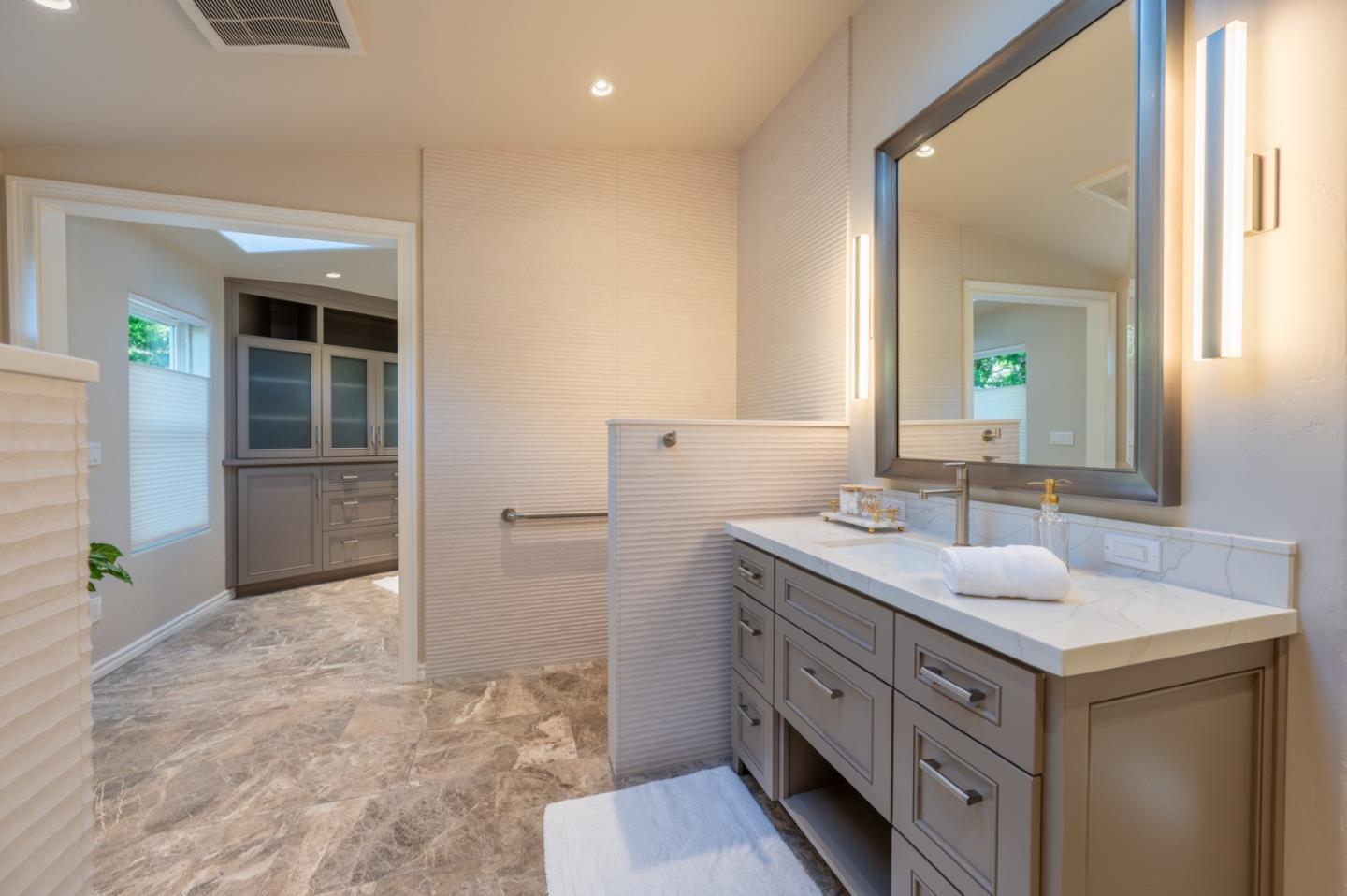 26345 Ladera Drive Carmel, CA 93923 - Photo 28 of 41 a bathroom with a sink and a mirror