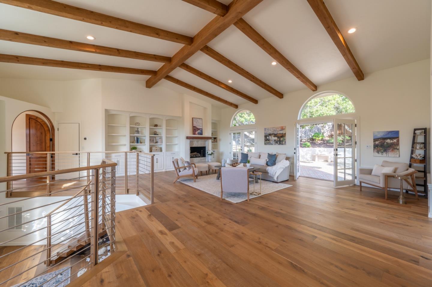 26345 Ladera Drive Carmel, CA 93923 - Photo 4 of 41 a living room with fireplace furniture and a large window