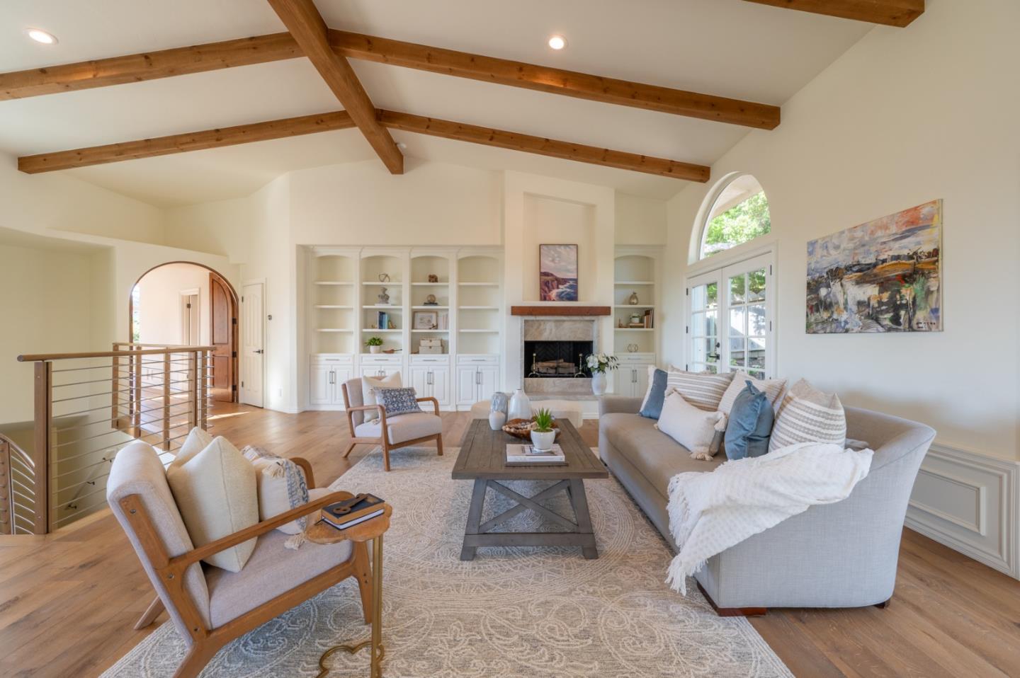 26345 Ladera Drive Carmel, CA 93923 - Photo 7 of 41 a living room with furniture a fireplace and a large window