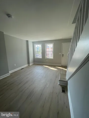 a view of livingroom with window and hardwood floor