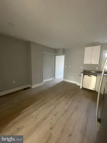 a view of a livingroom with wooden floor