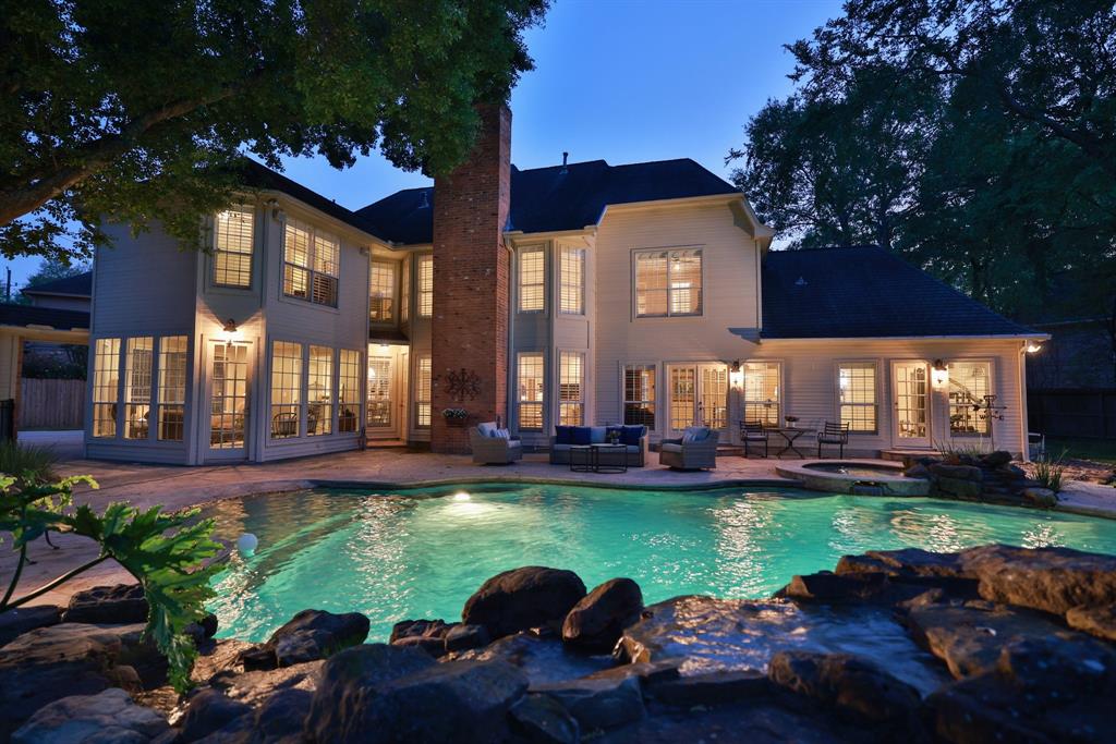 8515 Delachase Circle Spring, TX 77379 - Photo 1 of 50 This backyard is spectacular! Rock waterfalls, slide, cave and beach entry pool!