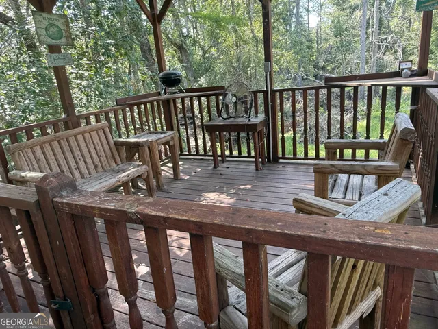 a view of a balcony with wooden floor
