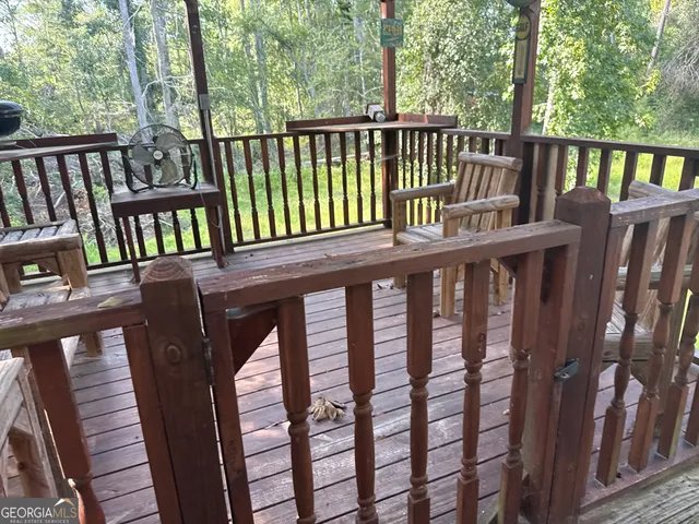 a view of a wooden deck with a bench