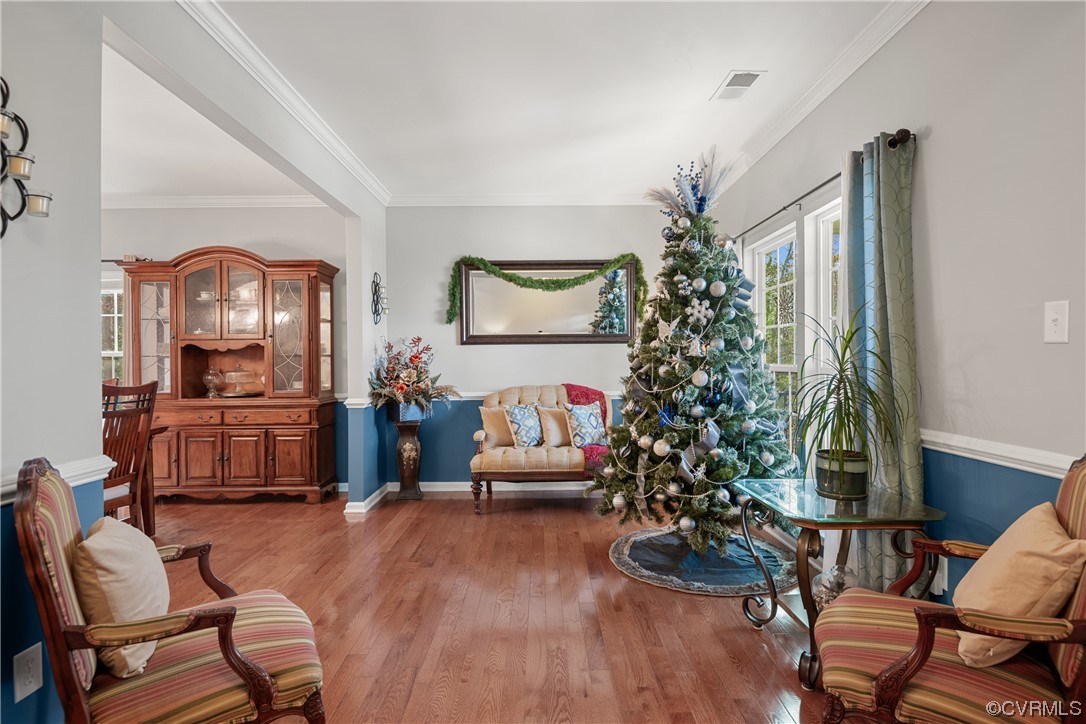 7031 Crackerberry Drive Moseley, VA 23120 - Photo 11 of 47 a living room with furniture and a christmas tree